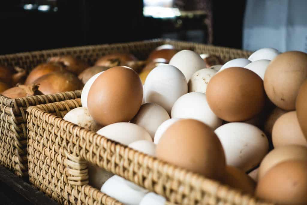Dozens of eggs in a basket.