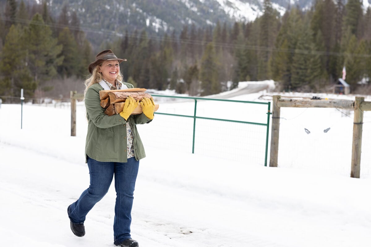A woman carrying firewood.