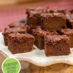 Pinterest pin for fudgy sourdough brownies with photos of brownies on a serving platter.
