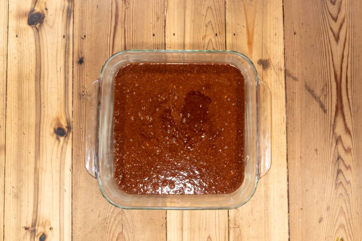 Sourdough brownie batter in an 8x8 pan.