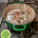 Pinterest pin for homemade corned beef with an image of a pot on the stove with the brining liquid inside.