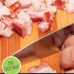 Pinterest pin for rendering lard with an image of chopped pig fat on a cutting board.