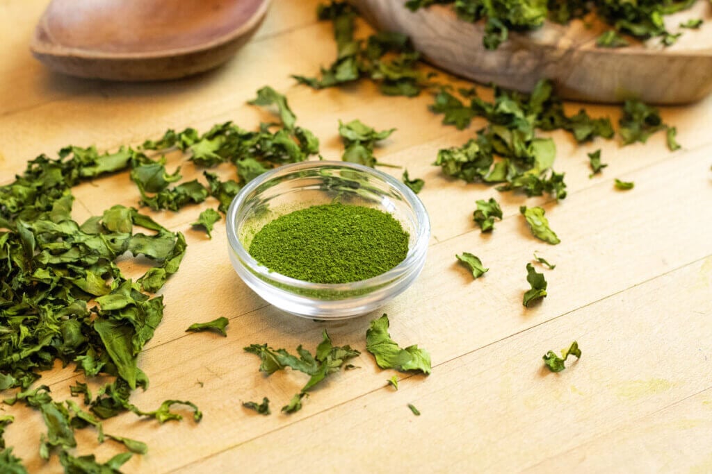 Freshly milled dried greens in a glass bowl.