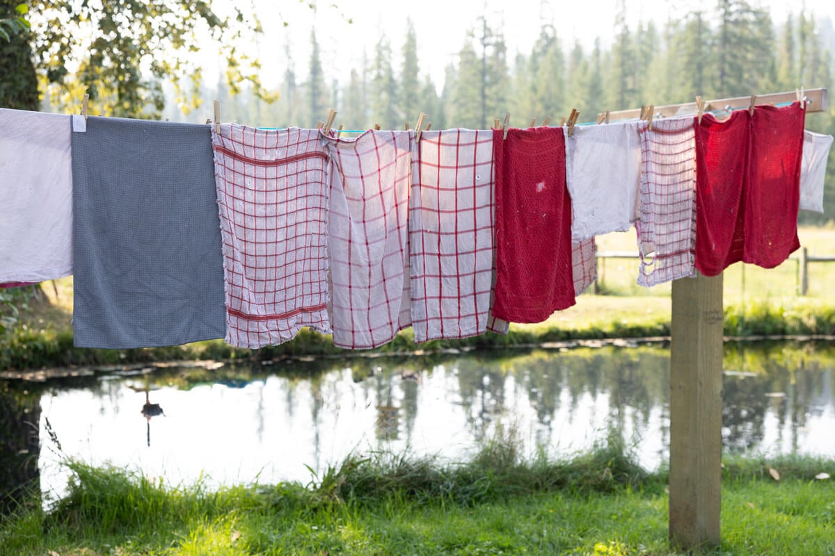 Towels air drying outside on a clothesline.