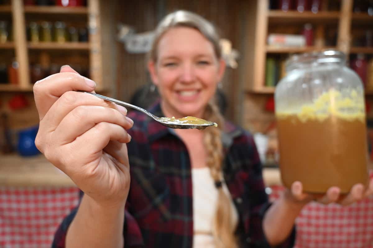 An up close view of a spoon of gelled bone broth.