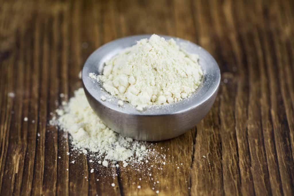 Onion powder in a small bowl.