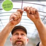 Pinterest pin on things you should consider before going off grid. Image of a man working on a hoop house.