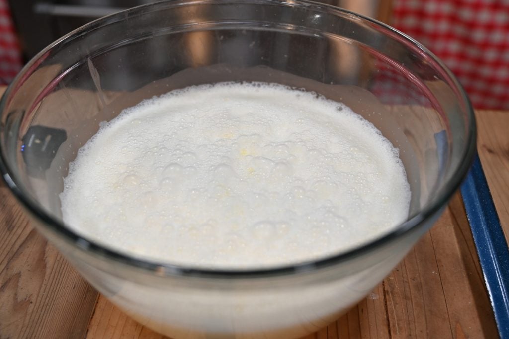 Fluffy eggnog in a glass bowl.