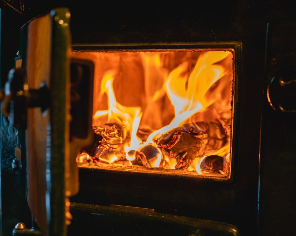 Wood cook stove fire burning.