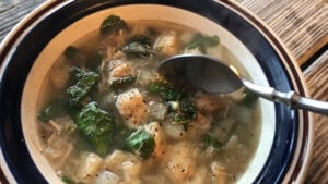 Bread soup in a bowl with a spoon.