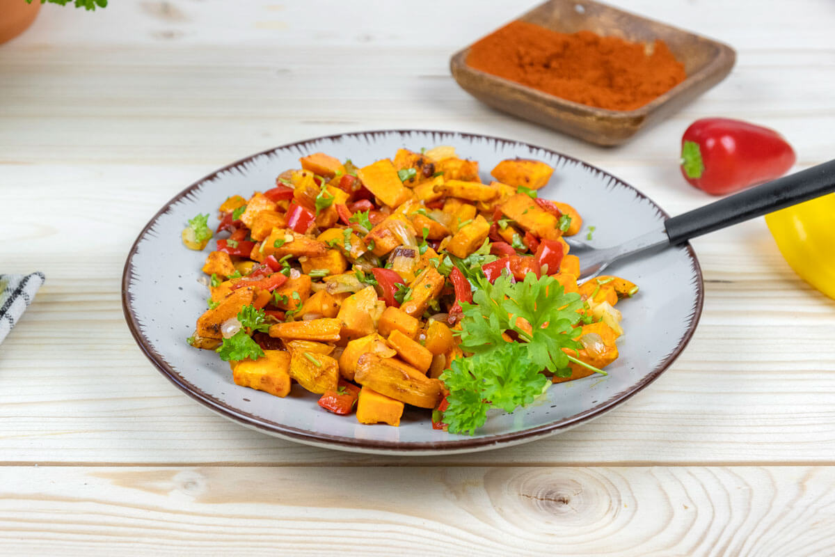 Sweet pepper hash dished up in a white bowl.