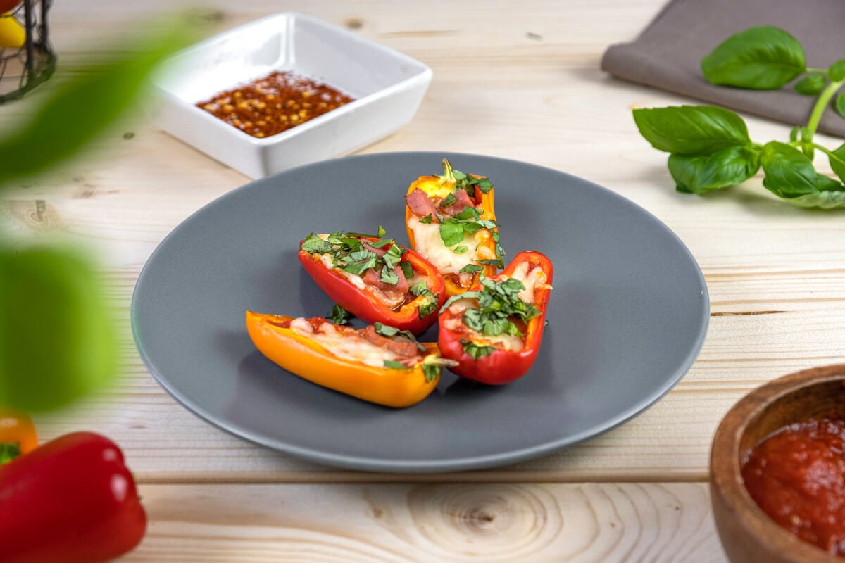 Bell pepper pizzas on a gray plate.