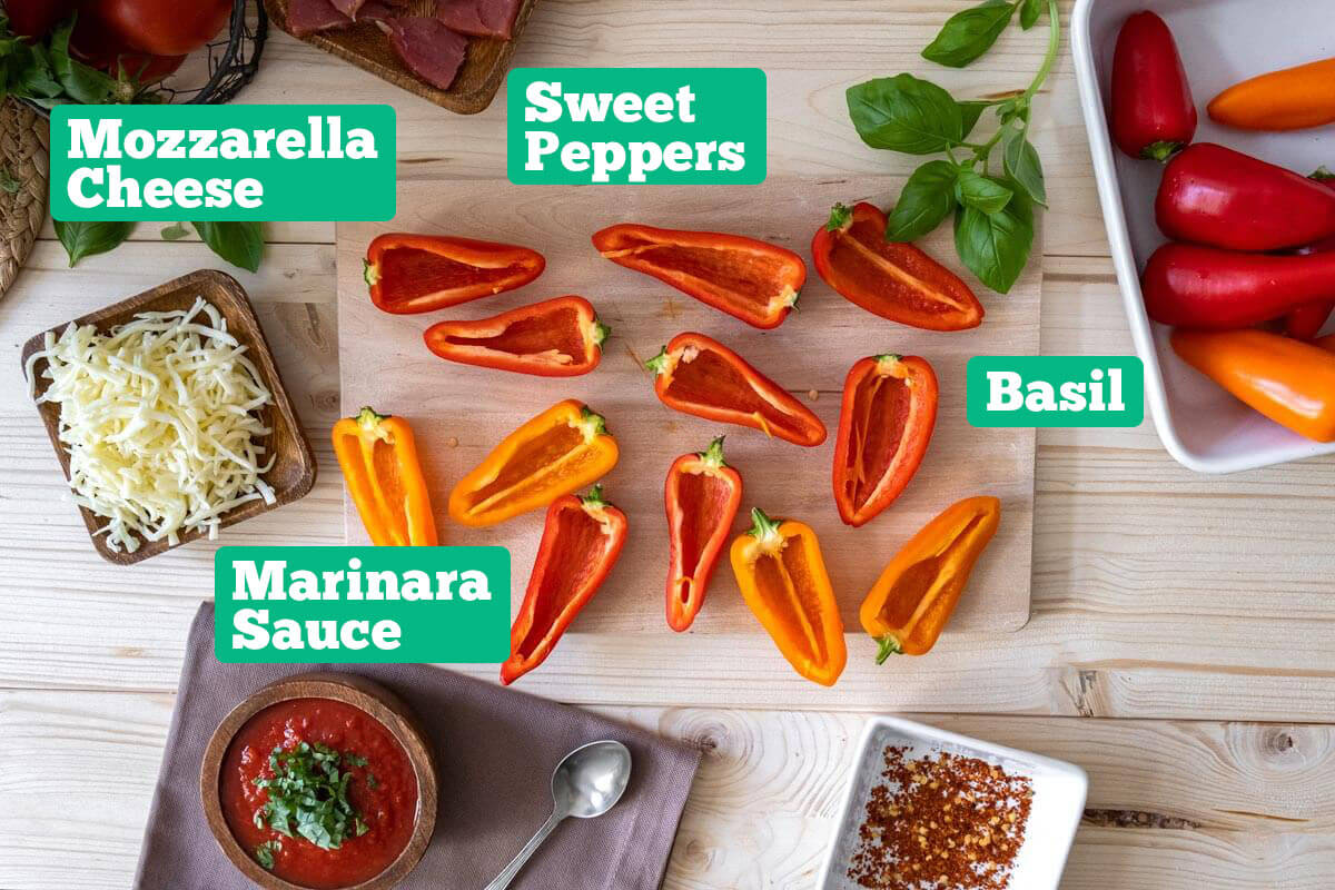 Bell pepper pizza ingredients: peppers, basil, marinara sauce, and mozzarella cheese.