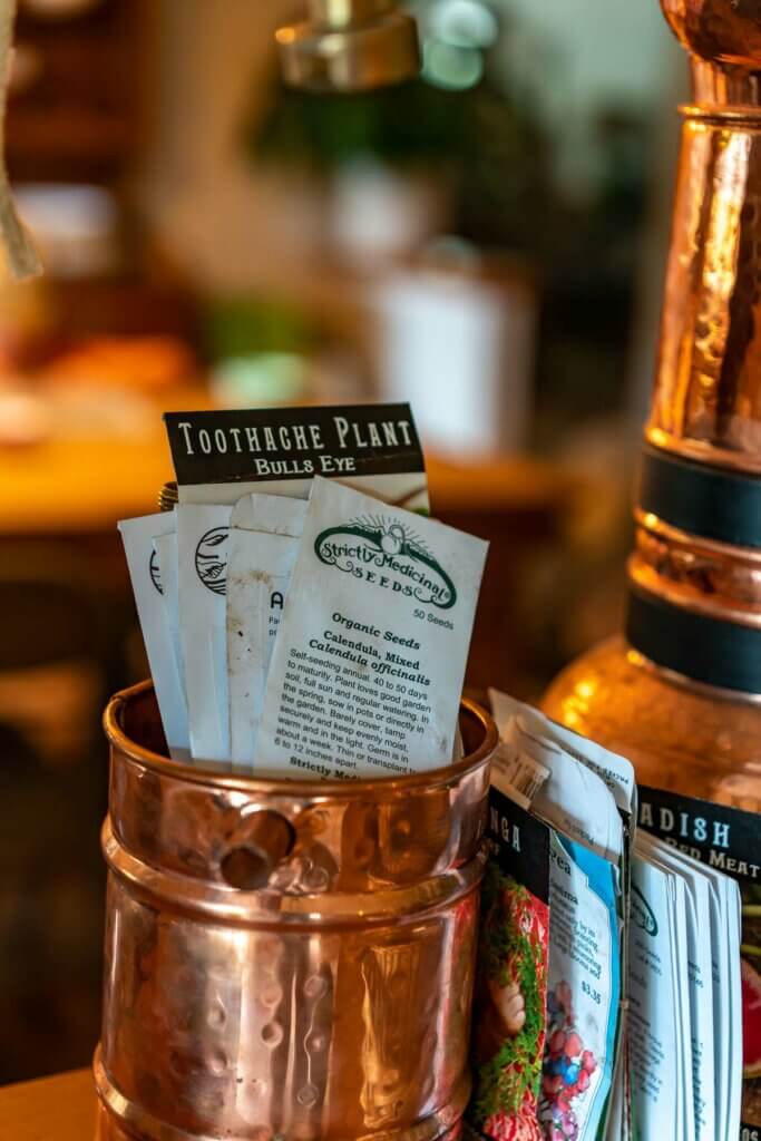 Seed packets in a copper tin.