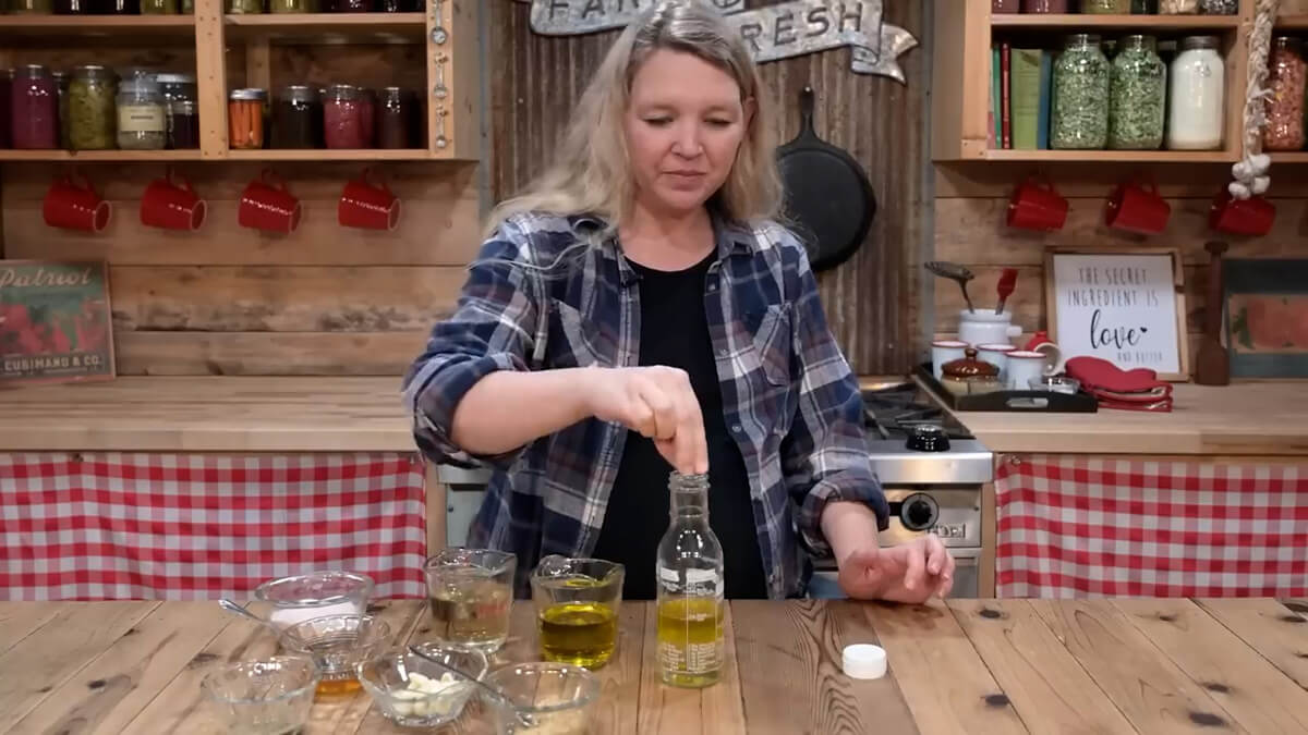 A salad dressing bottle with vinaigrette ingredients.