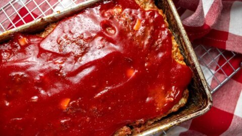 Close overhead view of glazed meatloaf in a loaf pan.