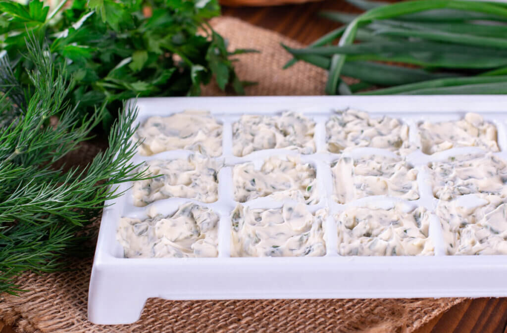 Herb butter in ice cube trays.