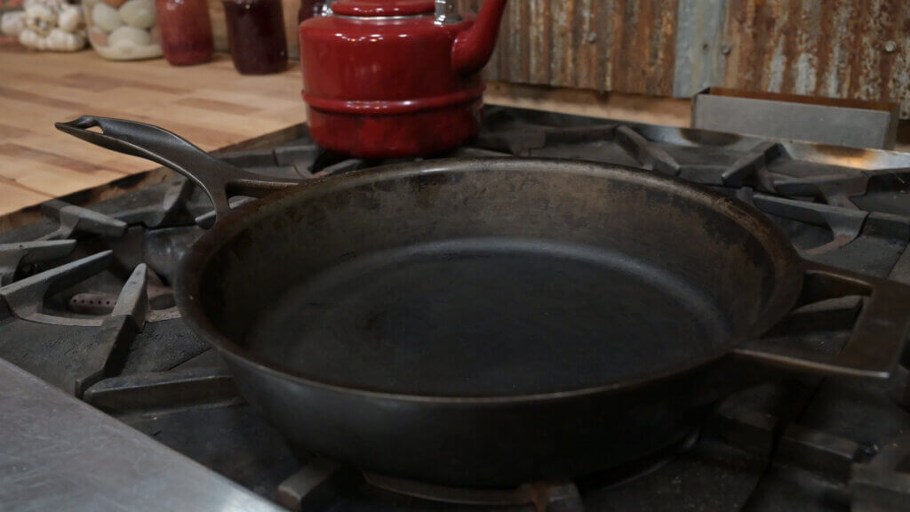Cast iron pan on a stovetop.