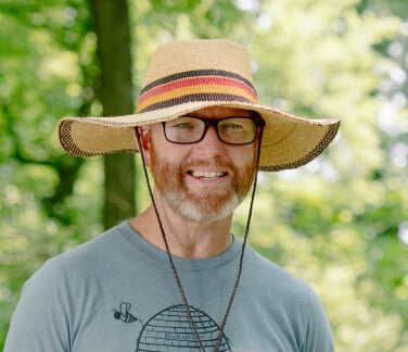 Adam Martin in a wide-brim hat.