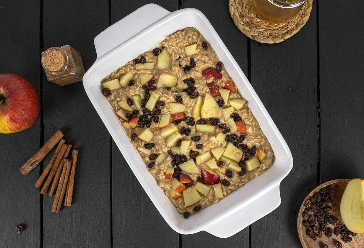 Unbaked oatmeal bake in a 9x13 white pan.