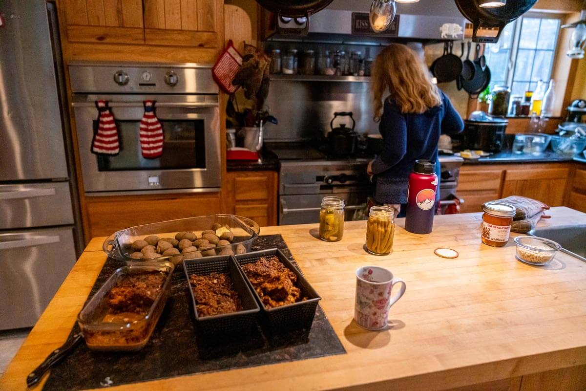 A young girl cooking in the kitchen.