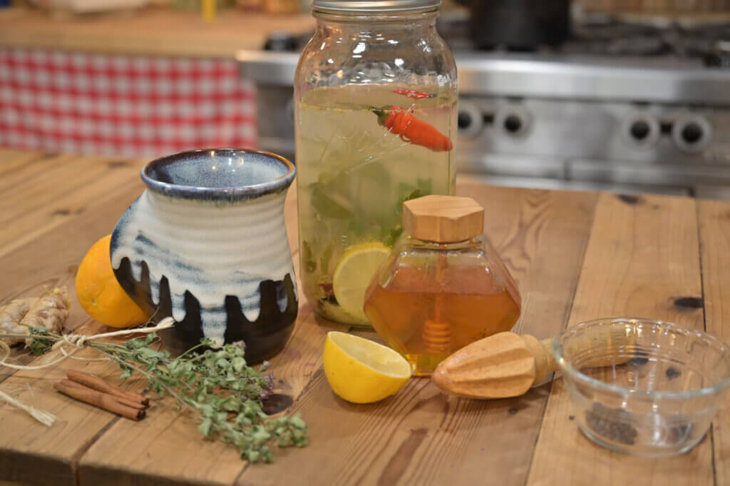Herbal cold and flu tea in a half-gallon Mason jar.
