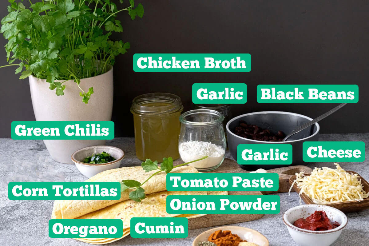 Black bean enchilada ingredients: Chicken broth, garlic, black beans, cheese, tomato paste, onion powder, cumin, oregano, corn tortillas, and green chilis.