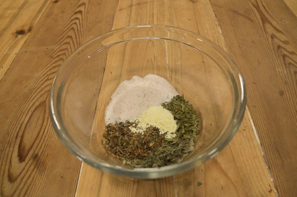 Herbs and seasonings in a glass bowl.