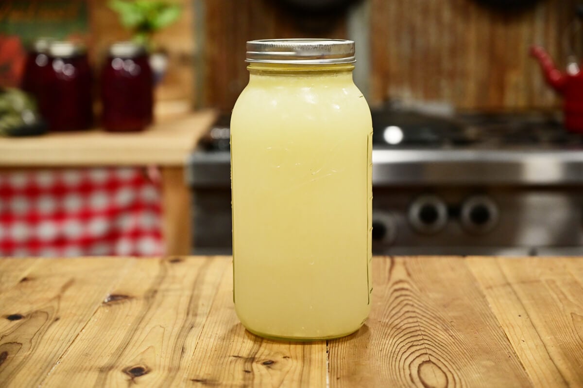 Whey in a glass half-gallon Mason jar.