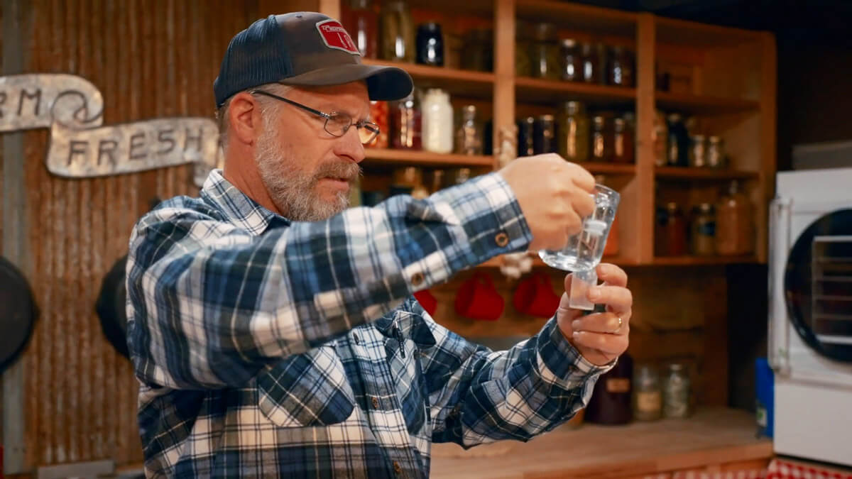 A man testing various substances for glyphosate.