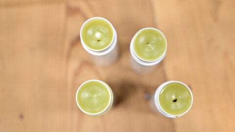 Four tubes of an herbal headache salve.