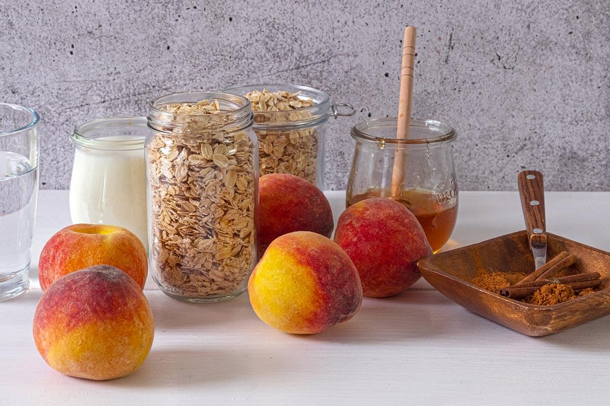 Peaches and cream instant pot oatmeal ingredients on a counter.