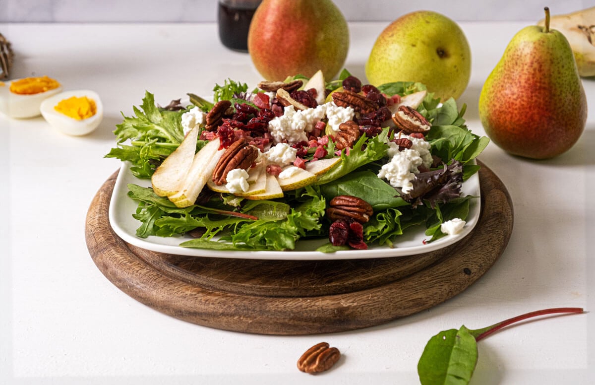 Pear salad on a white plate.