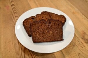 Gluten free pumpkin bread sliced on a white plate.