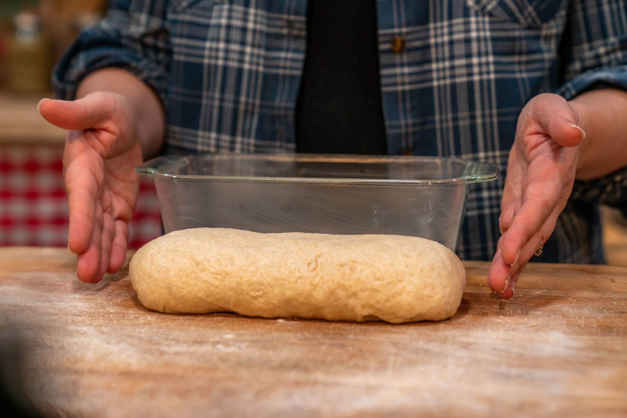 Bread dough shaped and ready to be placed into a loaf pan to rise.