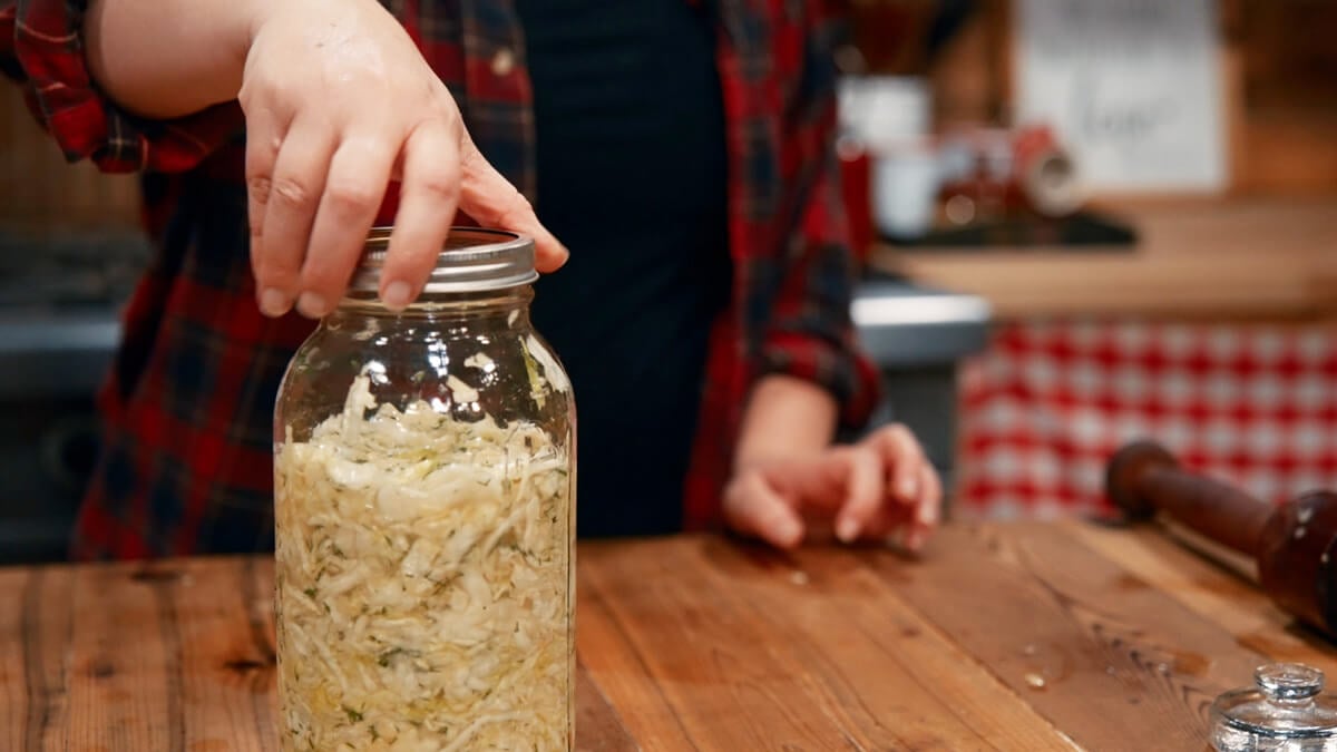 A jar of garlic dill sauerkraut.