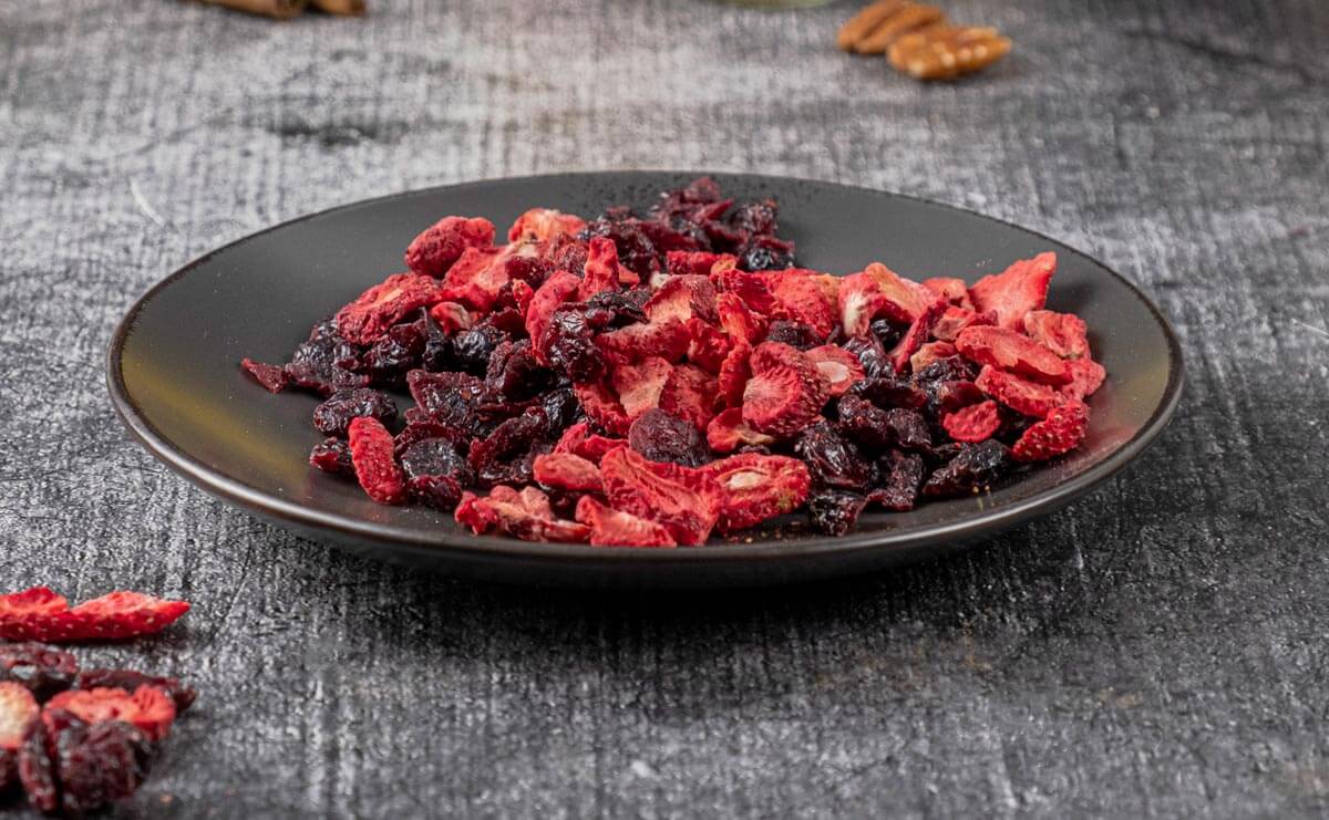 Dried fruit on a plate to make fruitcake cookies.