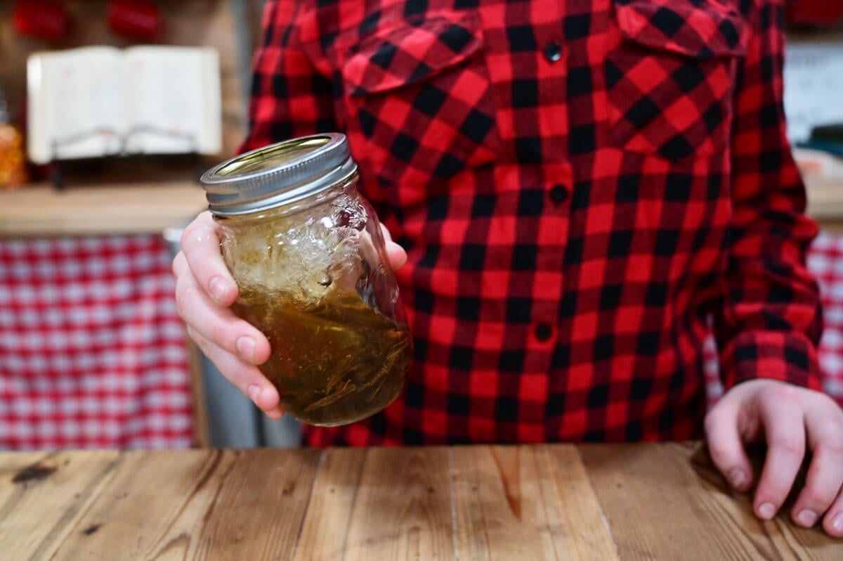 Finished vanilla extract in a Mason jar.