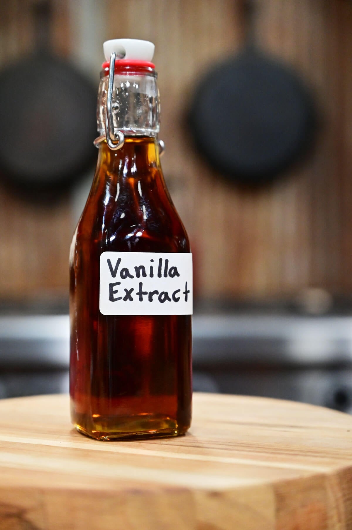 Homemade vanilla extract in a flip top decorative bottle.