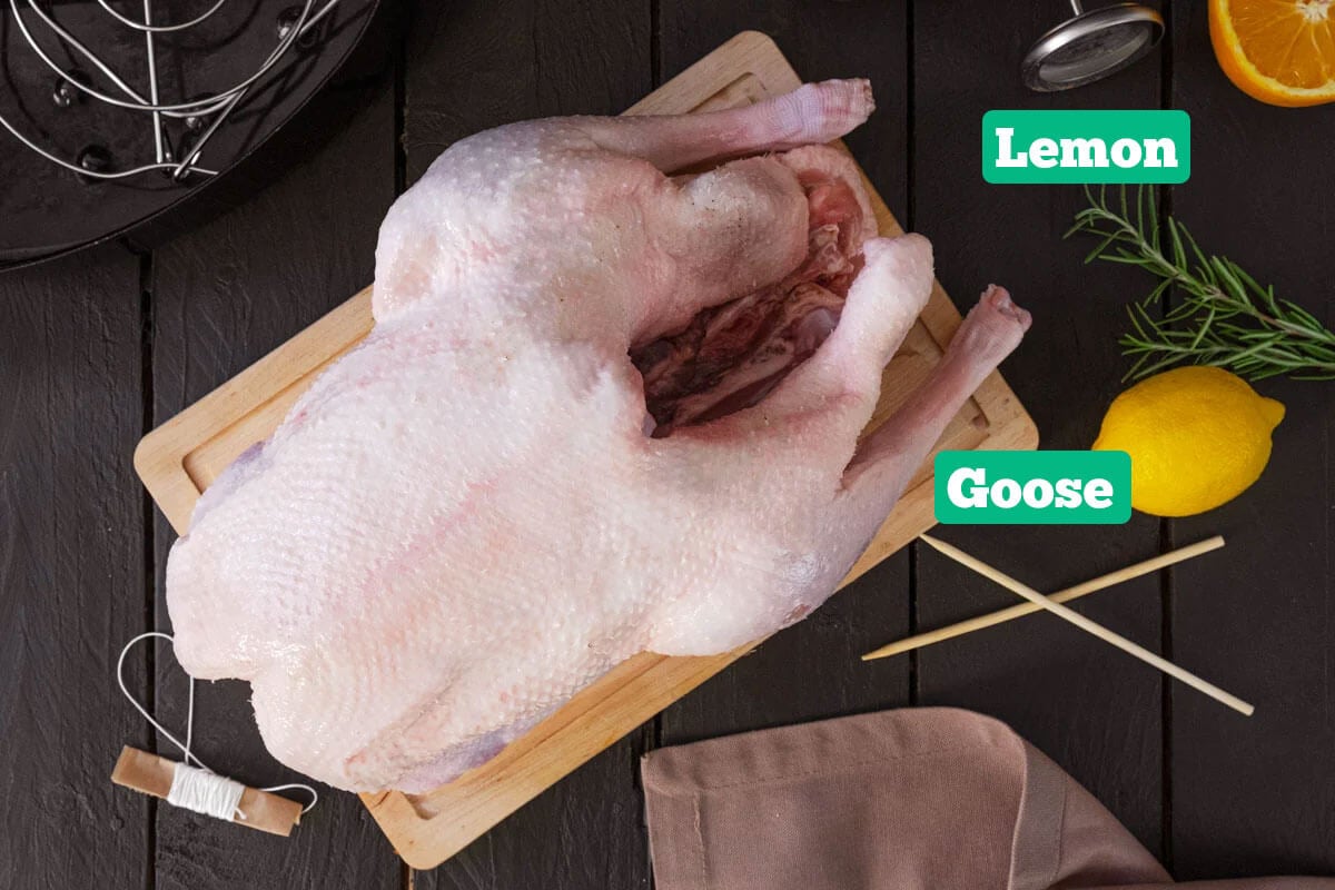 Roast goose recipe ingredients: goose and lemon.