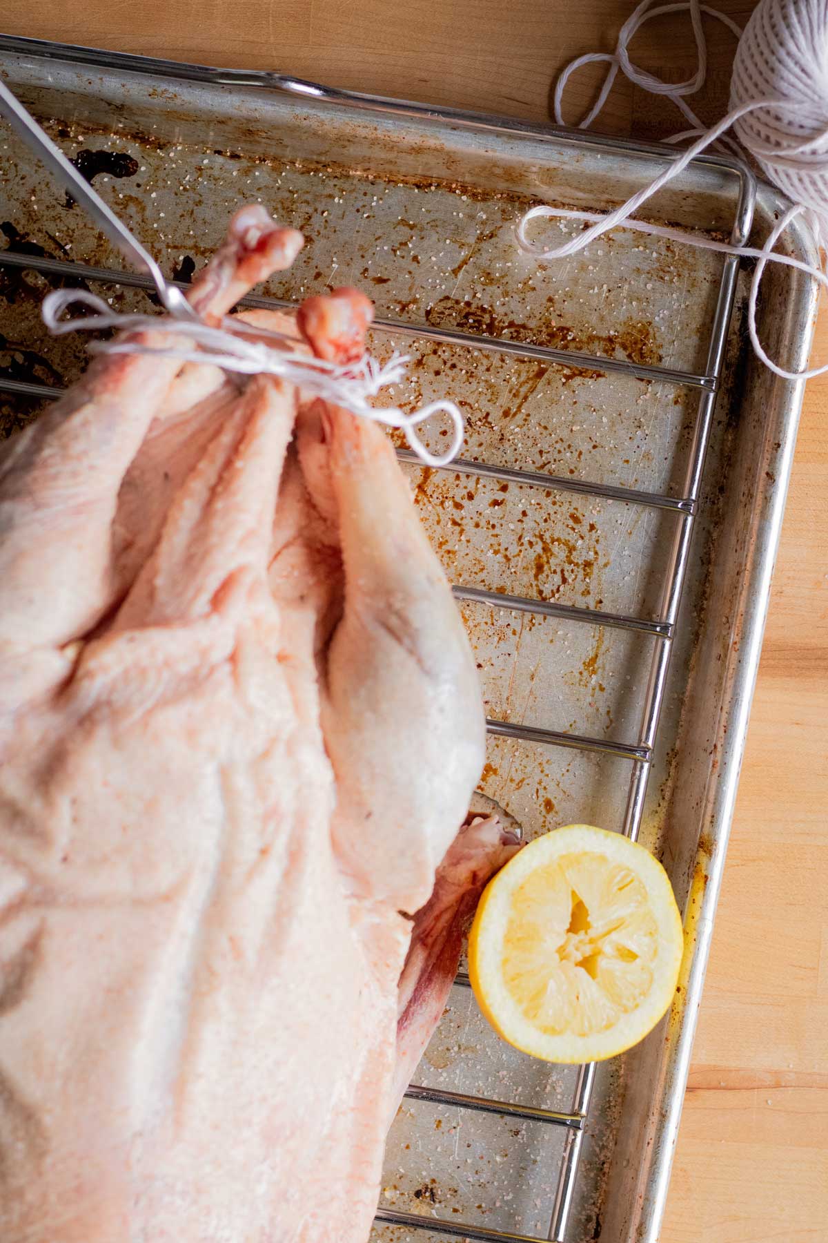 Goose legs trussed together and ready to roast.