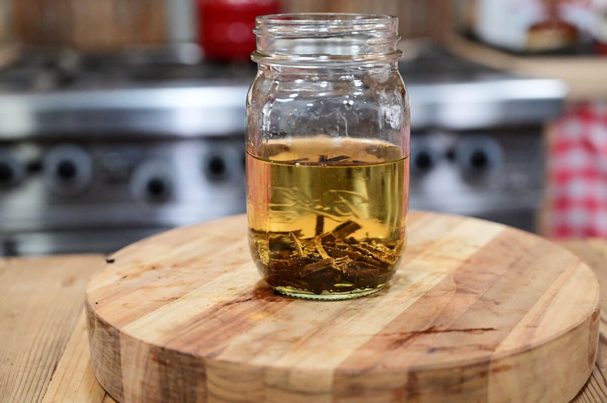 Vanilla extract being made in a Mason jar.