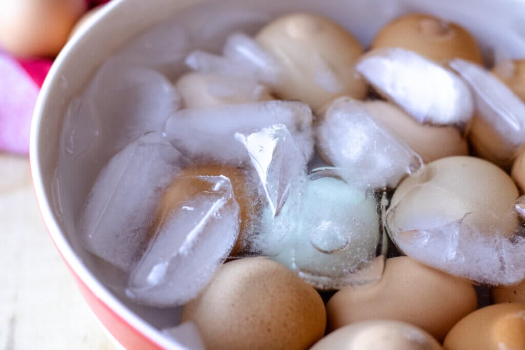 Hard boiled eggs in an ice bath.
