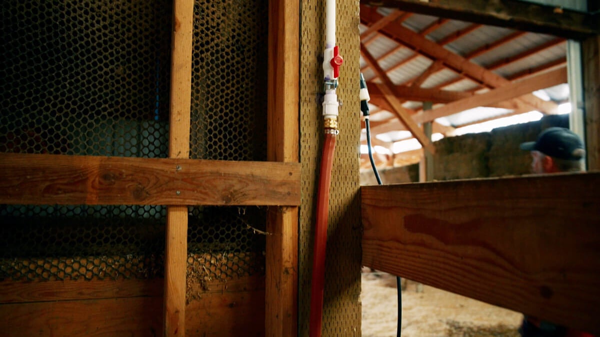 A shutoff valve for a gravity fed watering system inside a barn.