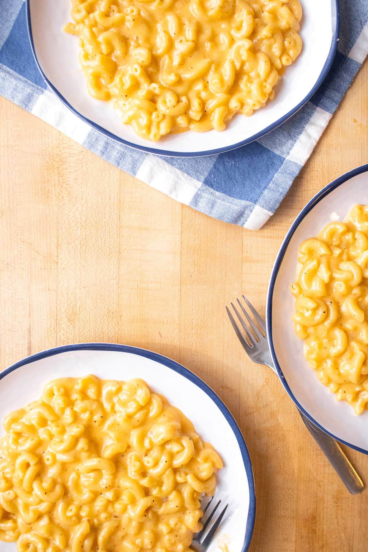 Plated macaroni and cheese in bowls.