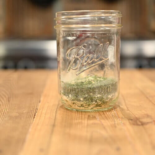 Dry ranch seasoning mix in a Mason jar.