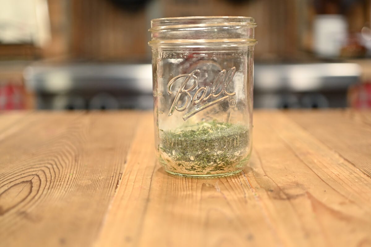 Dry ranch seasoning mix in a Mason jar.