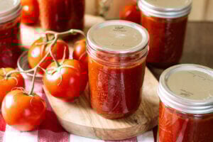 Home canned BBQ sauce in pint jars with bands removed.