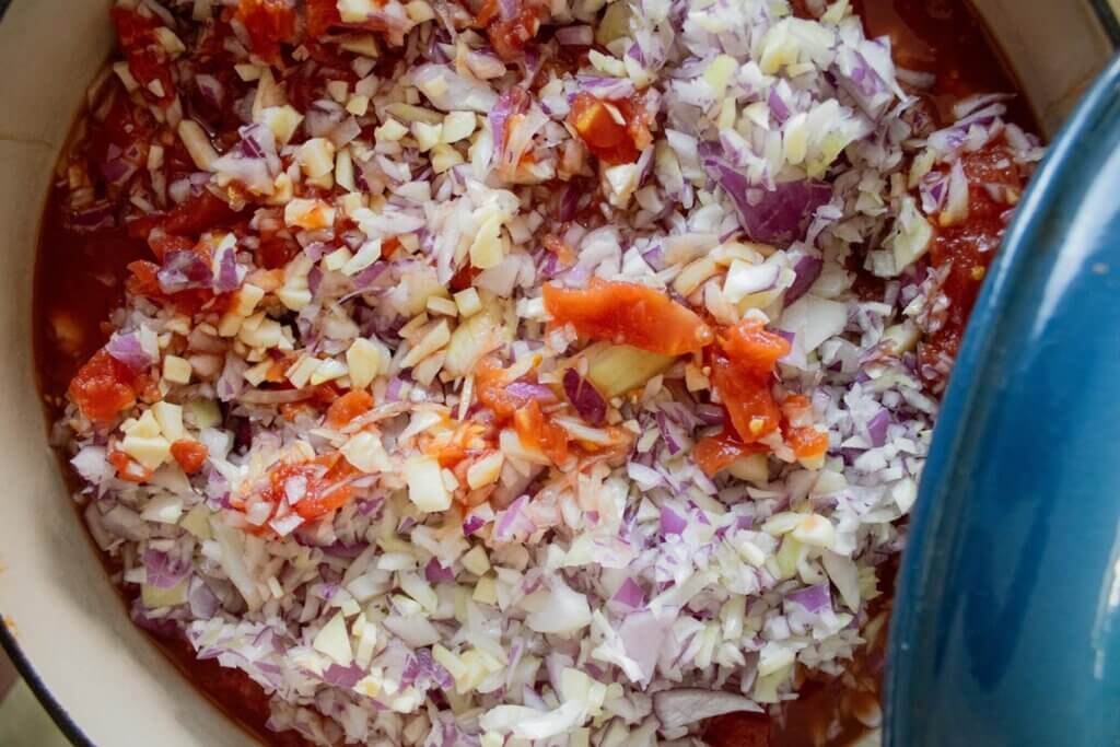 Uncooked BBQ sauce ingredients in a stock pot.