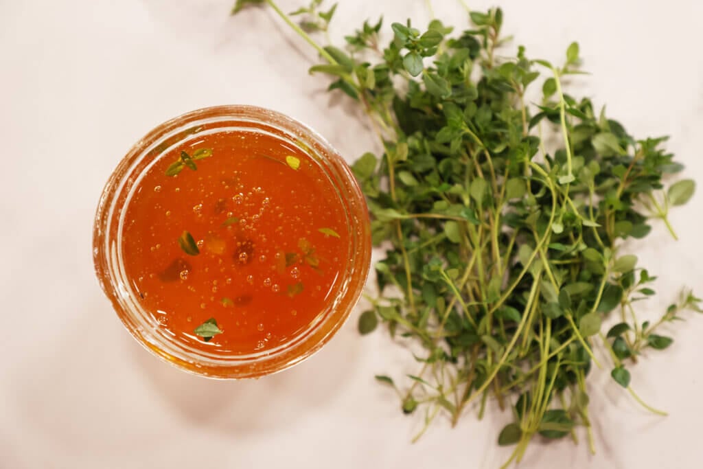 Herbal honey and fresh herbs.